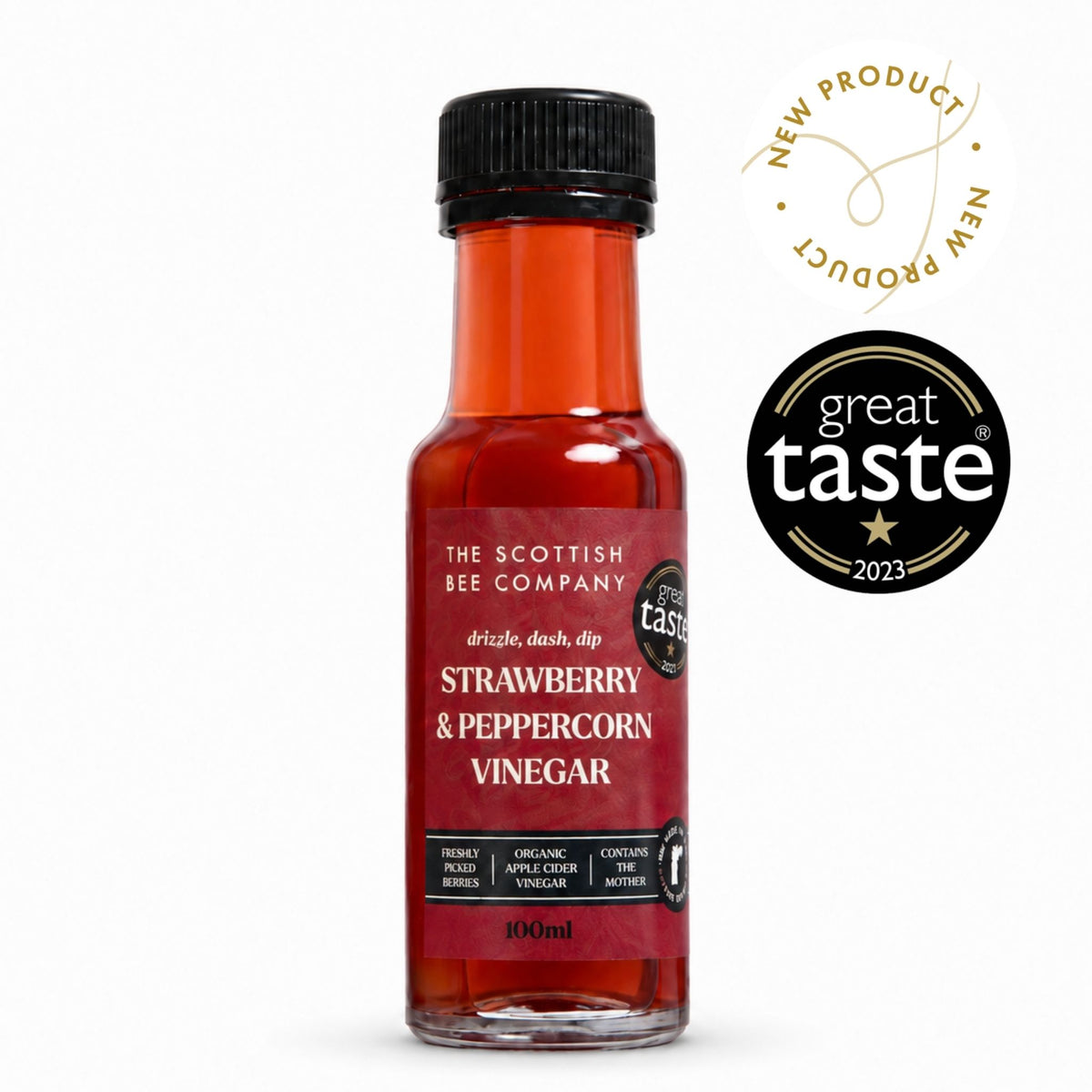 A 100ml bottle of Strawberry &amp; Peppercorn Vinegar by The Scottish Bee Company, featuring a black cap and a red label, shown on a white background with a &